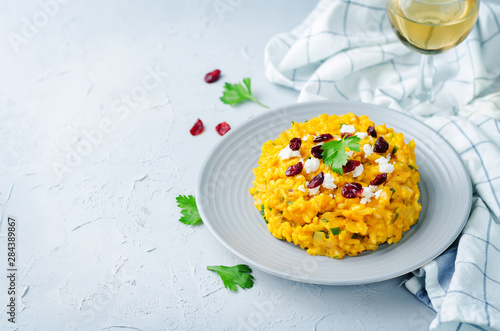 Pumpkin risotto with dried cranberries and goat cheese