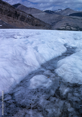 Canada, Alberta, Columbia Icefields. Melting snow forms a stream at the Athabasca Glacier, Columbia Icefields, Jasper NP, a World Heritage Site, Alberta, Canada