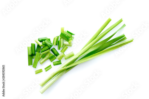 Fresh healthy organic green vegetable garlic chives, chinese chive sliced, green herb isolated on white background.