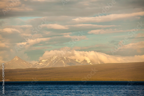 Canada, Yukon Territory, Destruction Bay, Kluane National Park and Reserve. Sunset at Kluane Lake and Mt. Cairnes photo