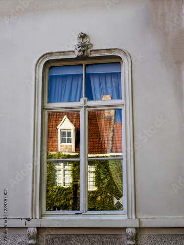 Belgium  Brugge  West Flanders  Reflections in window of town