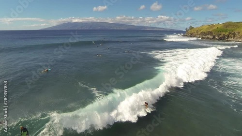 Aerial shot of sufers in Hawaii  photo