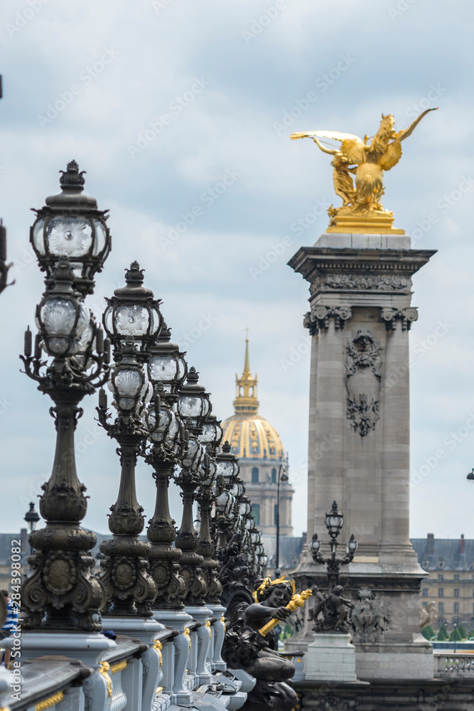 Golden statue on Pont Alexandre III, Paris, France, Europe