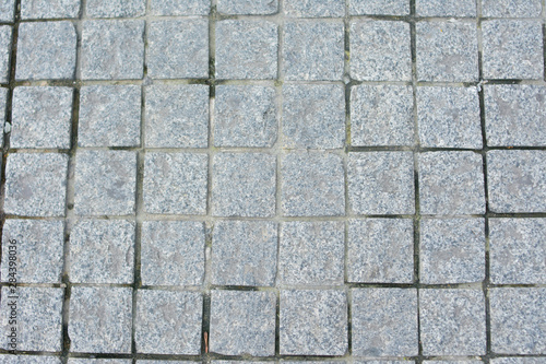 Old paving slabs  texture paving stone track  closeup  top view
