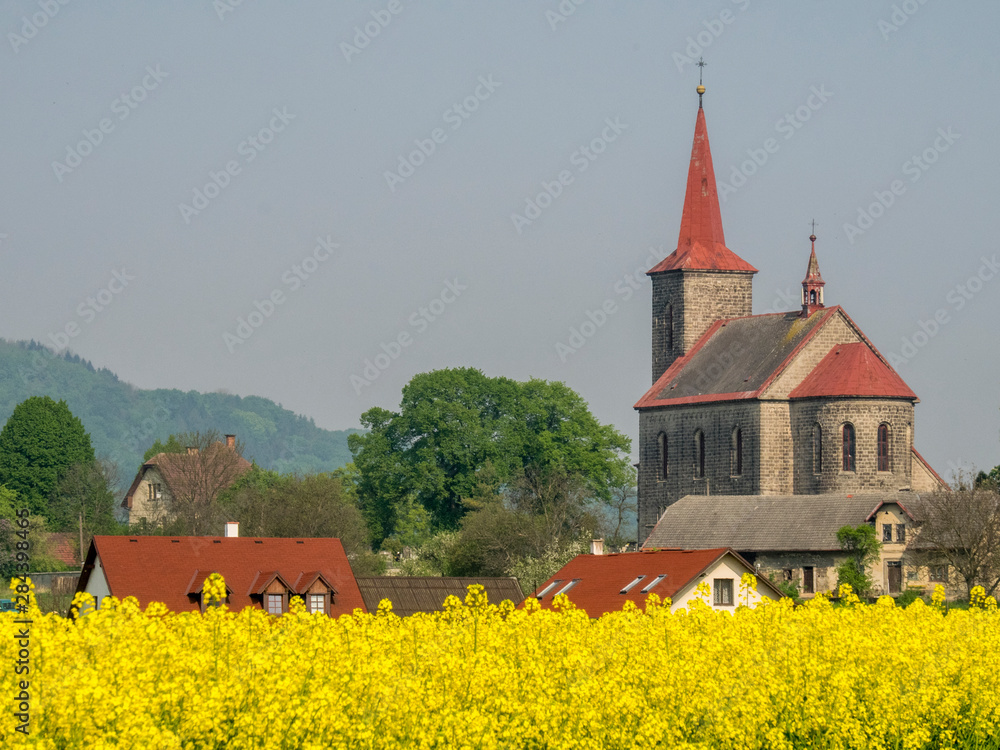 Czech Republic. St. John the Baptist church in the village of Ujezd pod Troskami in the Hradec Kralove region of Czech Republic.