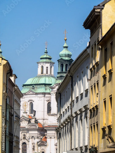 Czech Republic  Prague. St Nicholas Church dome above orange roof tops of Mala Strana.