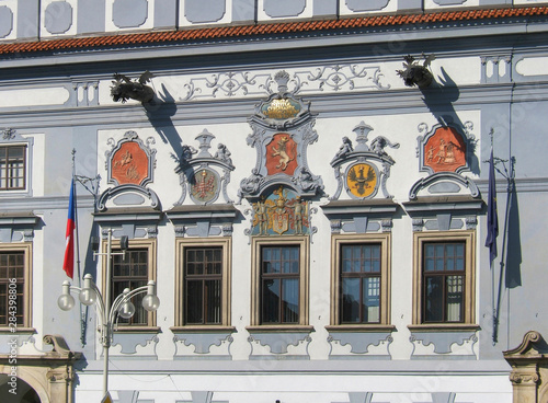 Czech Republic, Ceske Budejovice. Colorful plaques adorn the facade of the Radnice, or town hall, in Ceske Budejovice, South Bohemia, Czech Republic. photo