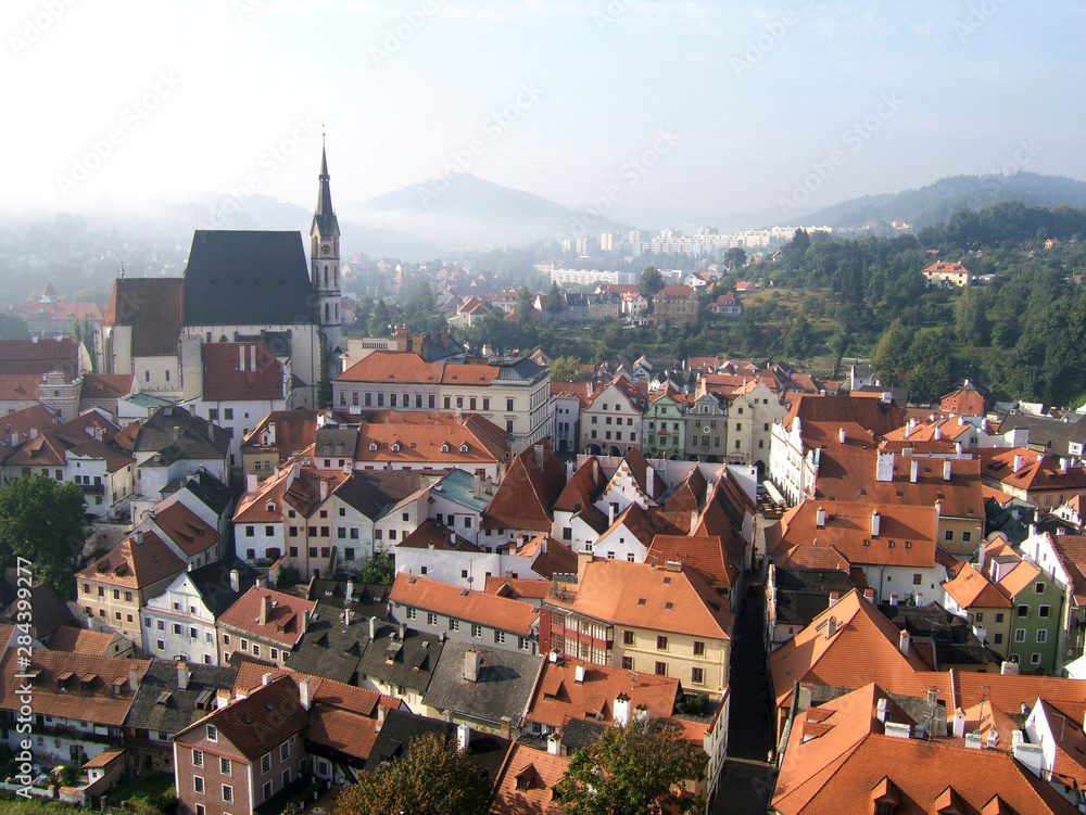 Obraz premium Czech Republic, Cesky Krumlov. Autumn mist spills over the medieval town of Cesky Krumlov in South Bohemia, Czech Republic.