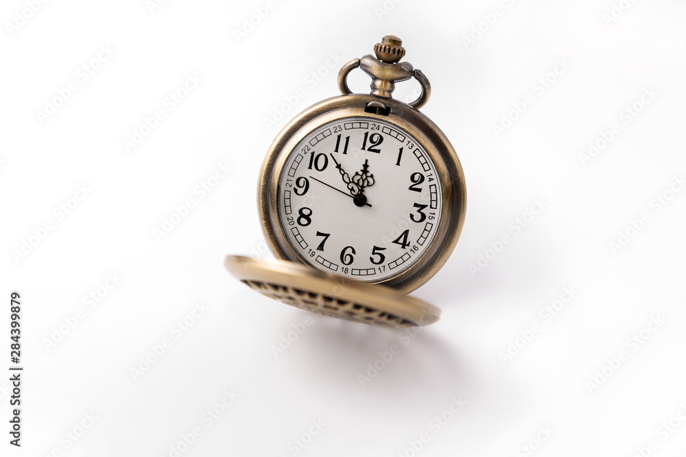 Old pocket watch closeup isolated on white background