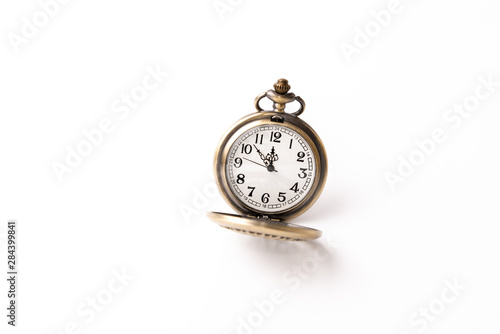 Old pocket watch closeup isolated on white background