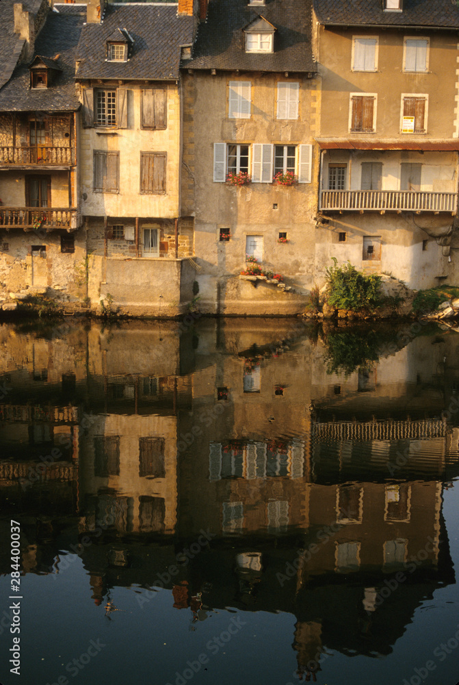 France: Averyon, Espalion, view of Lot River and homes with reflections, August.