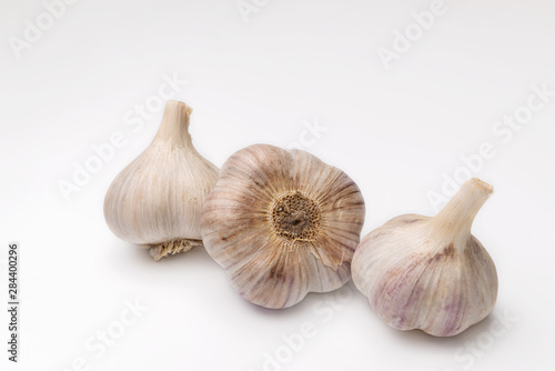 a strong-smelling pungent-tasting bulb, used as a flavoring in cooking and in herbal medicine.