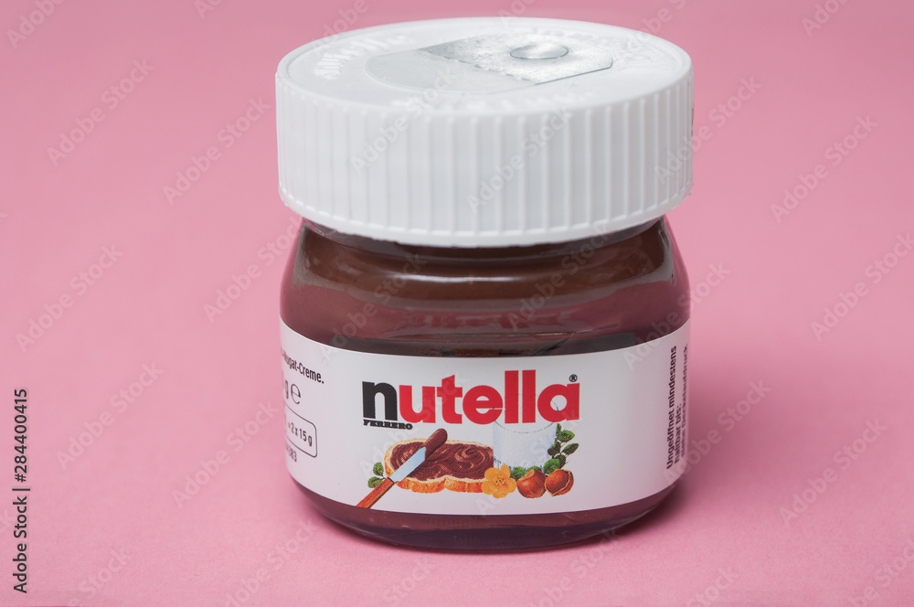 Closeup of mini Nutella container on pink background Stock Photo