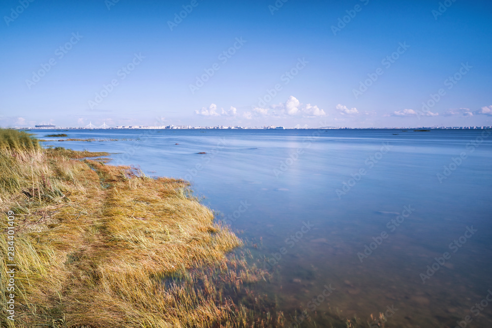 Sea landscape with distant view of Saint Petersburg, Russia