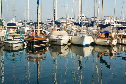 Boats and reflections in the marina area of Beaulieu sur Mer. on the coastline in the South of France.