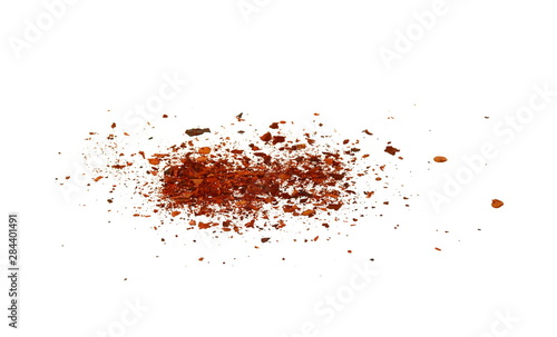 Cayenne pepper. Pile crushed red cayenne pepper, dried chili flakes and seeds isolated on white background