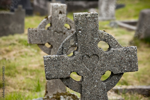 Ireland, County Mayo, Achill Island. Celtic gravestone crosses with heart carving at Kildownet Cemetery. photo
