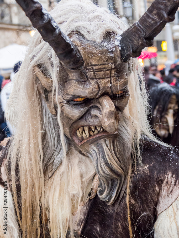Krampuslauf or Perchtenlauf during advent in Munich, an old tradition taking place during Christmas in the Bavarian Alps, Austria and South Tyrol, Germany. Krampuslauf or Perchtenlauf during advent in Munich, an old tradition taking place during Christmas in the Bavarian Alps, Austria and South Tyrol, Germany.