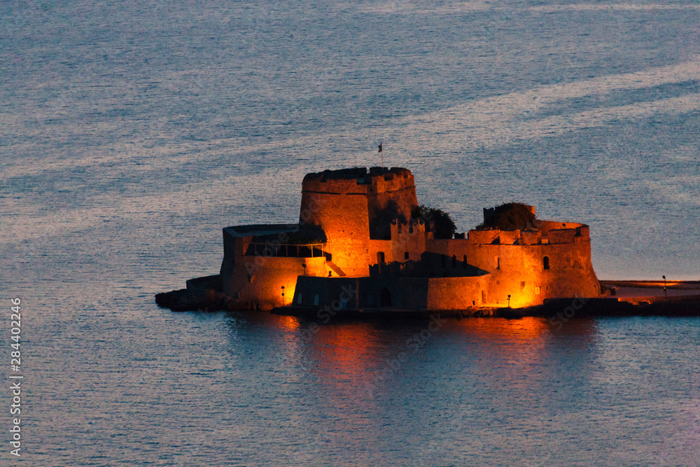 Night view of Bourtzi Castle in the Aegean Sea, Nafplio, Greece