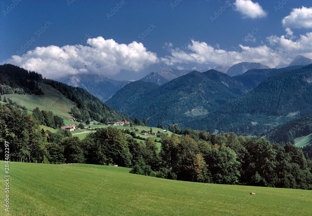 Germany, Bavaria, Ramsau. A small farm spills down the hillside near Ramsau, Bavaria, Germany.
