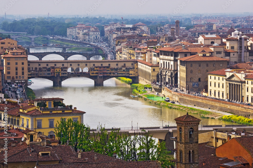 Italy, Florence. Overview of city and Ponte Vecchio bridge over Arno River. 