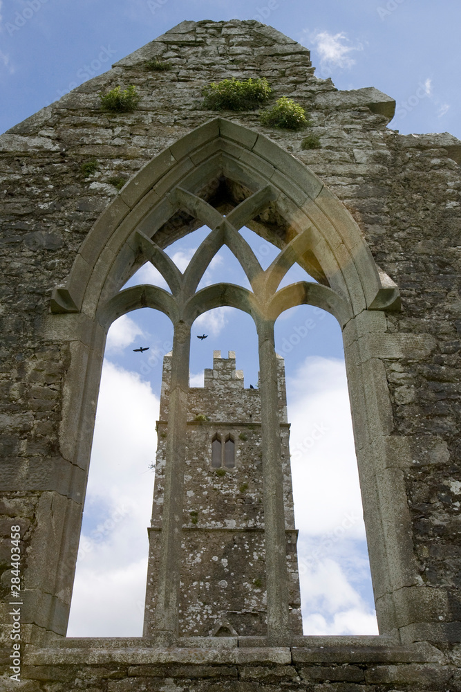 Ireland, Galway. Ross Errilly Friary bell tower viewed through an arched window.