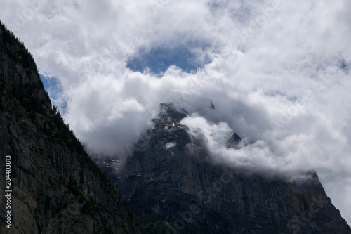 Alpine peaks with beautiful white clouds