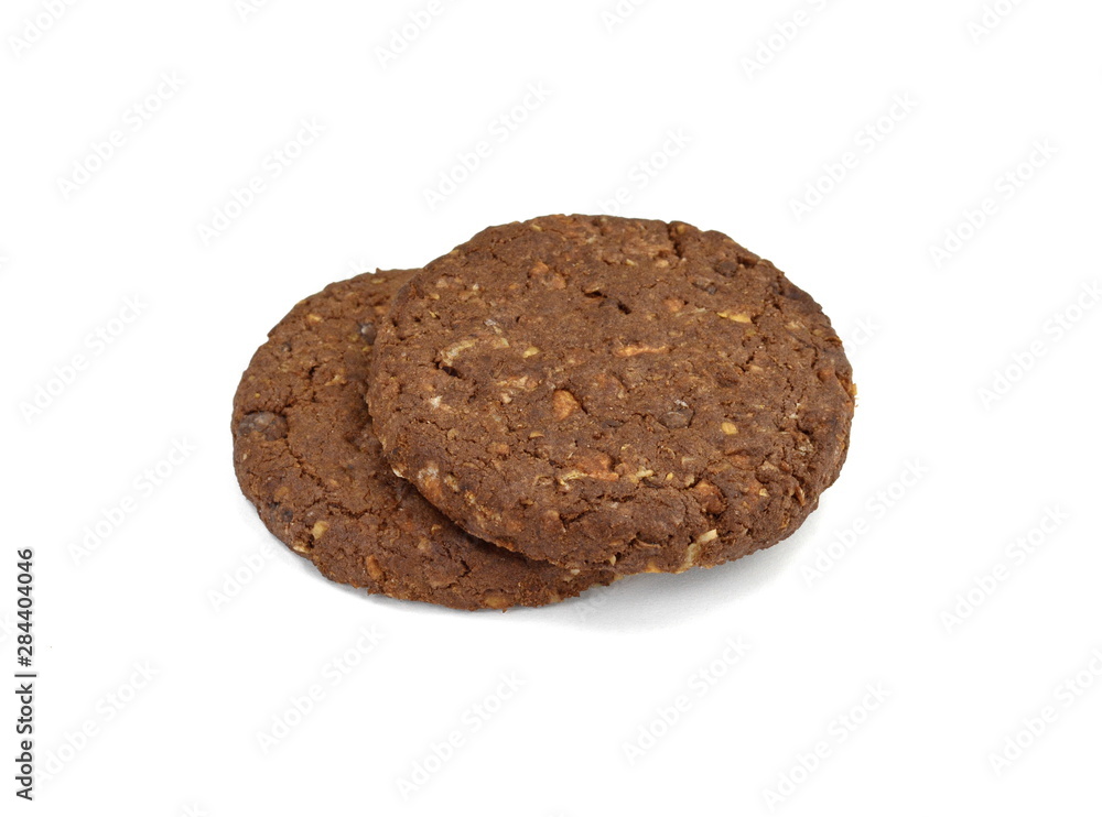 Round chocolate whole wheat biscuit, cookie with raisins isolated on white background. Chocolate Biscuits with whole-wheat (wholemeal) flour isolated on white background Round chocolate whole wheat biscuit, cookie with raisins isolated on white background. Chocolate Biscuits with whole-wheat (wholemeal) flour isolated on white background