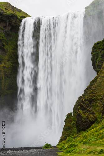 Iceland  Southwest Iceland  Skogafoss. There is heavy mist from the long fall of this waterfall.