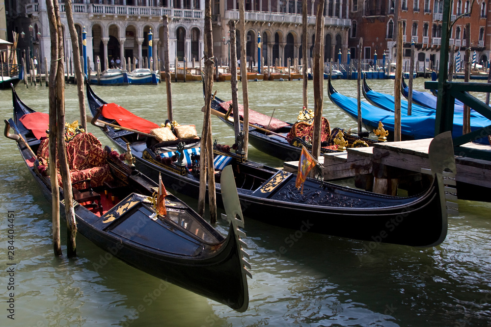 Italy, Venice. Gondolas docked on the Grand Canal.