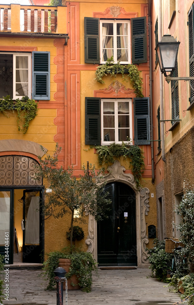 Italy, Santa Margherita Ligure. Inviting courtyard of a decorated building.