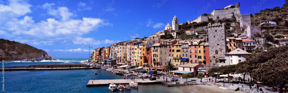 Italy, Portovenere. The brightly-painted buildings of Portovenere, a World Heritage Site, look over the waters of the Mediterranean Sea, in Liguria, Italy.