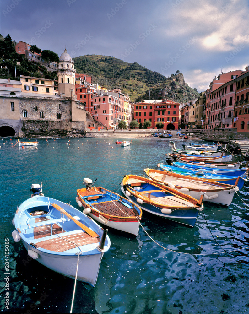 Italy, Vernazza. Brightly painted boats line the dock at Vernazza Harbor, Cinque Terra, a World Heritage Site, Italy.