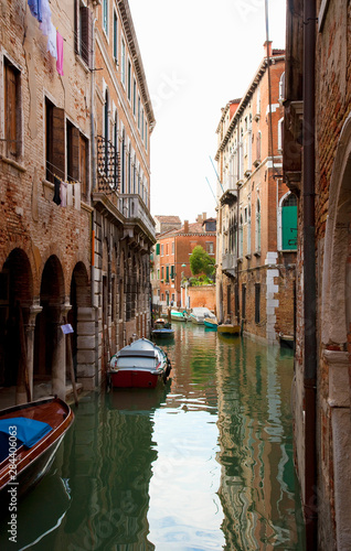 Venice, Veneto, Italy - Buildings surrounded by the canals in Venice, Italy. Boats are parked in the canals. © Inti St. Clair/Danita Delimont