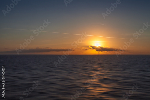 Sunset on the sea with italian coastline background © Gianluca