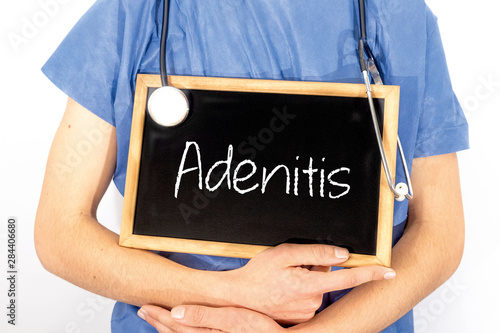 Doctor shows information on blackboard: adenitis.  Medical concept. photo