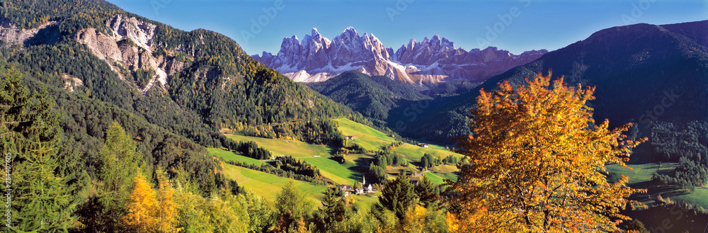 Italy, Santa Magdalena. Santa Magdalena lies nestled in the foothills below the jagged peaks of the Dolomite Alps, Italy.