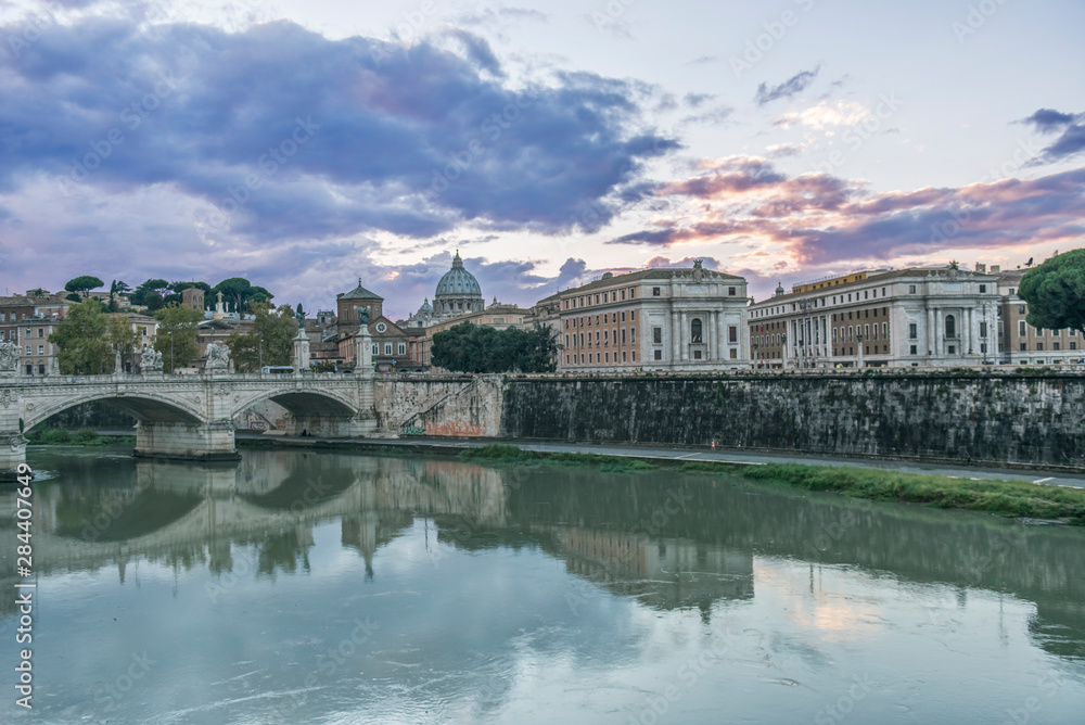 Italy, Rome, Tiber River and Ponte Vittorio Emanuele with St. Peter's Basilica in the Background at Sunset