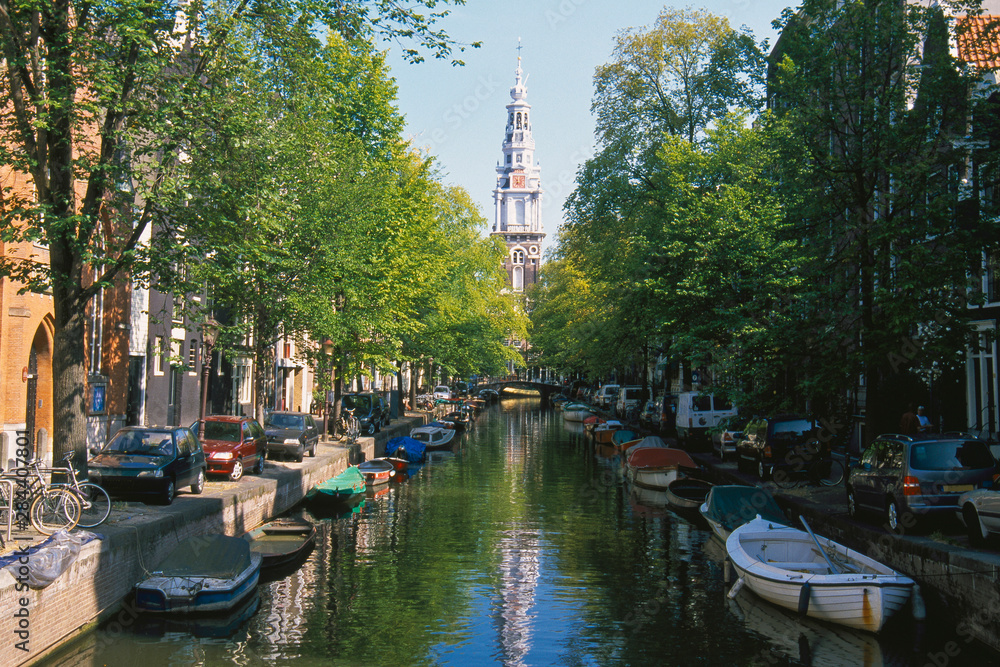 The Netherlands, North Holland, Amsterdam, Groenburgwal Canal, Spire of the Zuiderkerk church.