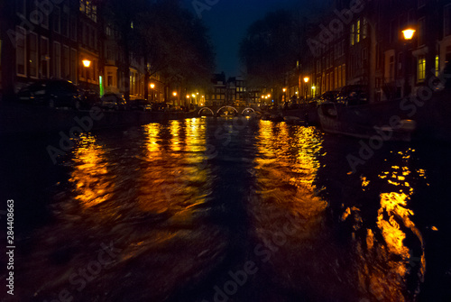 View of Amsterdam canal at night © Anna Miller/Danita Delimont