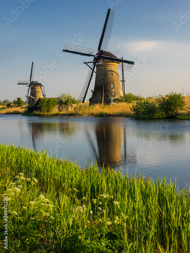 Netherlands, Kinderdijk, Windmills with evening light along the canals of Kinderdijk