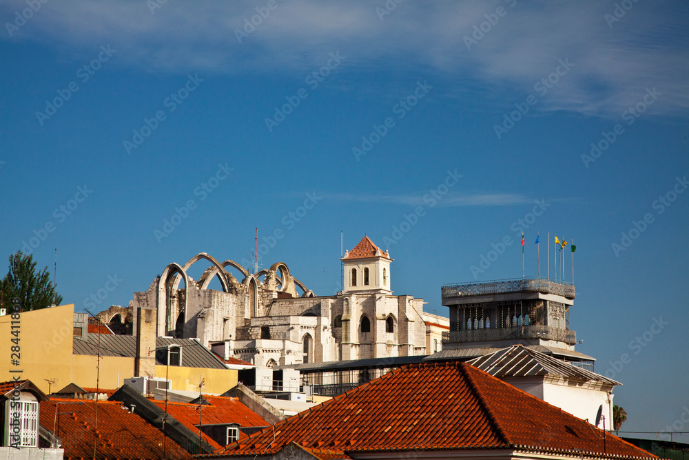 Fototapeta premium Portugal, Lisbon, View of rooftops over the town of Lisbon and the Carmo Church with no roof