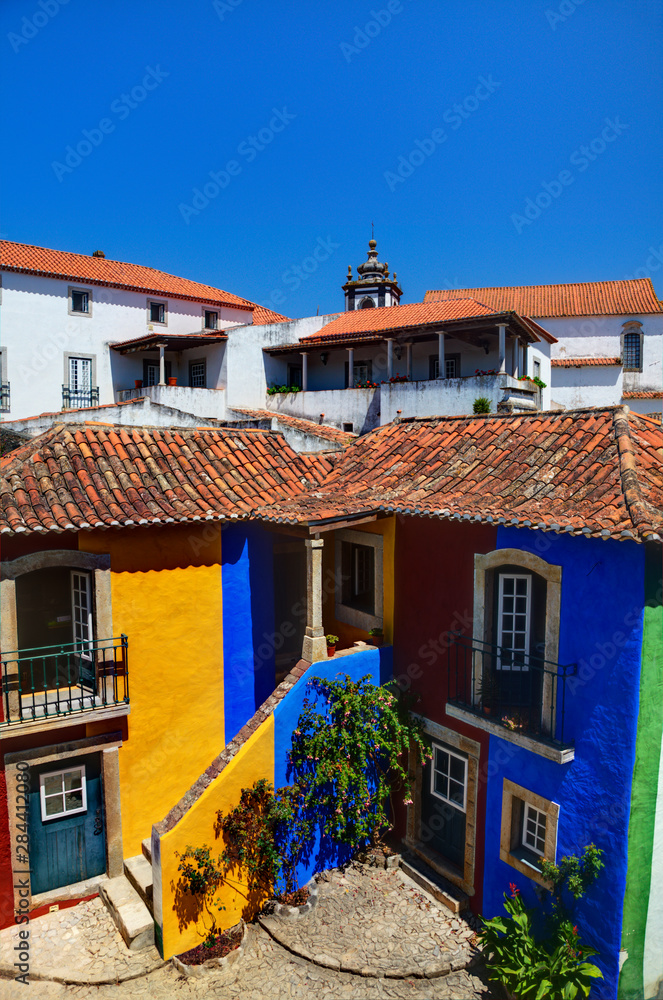 Portugal, Obidos, Multicolored House inside the walls of Town