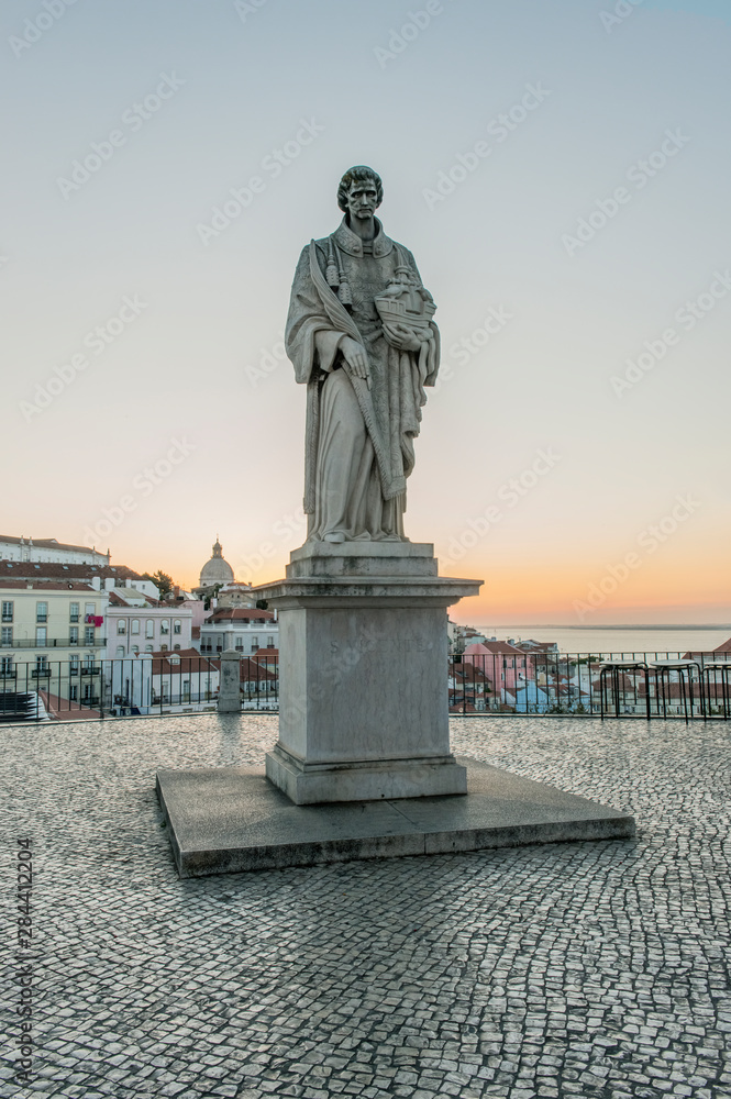 Portugal, Lisbon, Alfama, Largo Portas do Sol at Dawn, Statue of St. Vincent the patron saint of Lisbon
