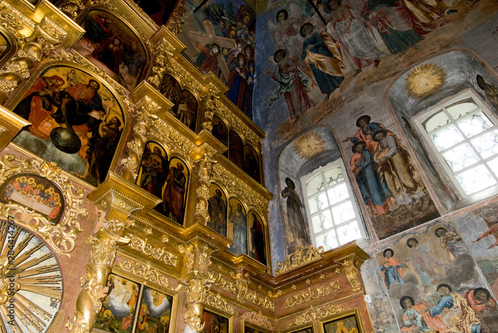 Fototapeta premium Russia, Golden Ring city of Uglich on the Volga. Church of St. Dmitry (aka Demetrius) on the Blood, interior. Ornate gold altar & painted fresco walls & ceiling.