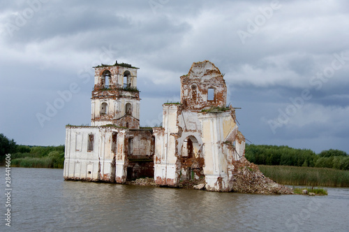 Russia, Typical river views between Goritzy & Kizhi Island, White Lake area. Old church in ruins along the river banks. photo