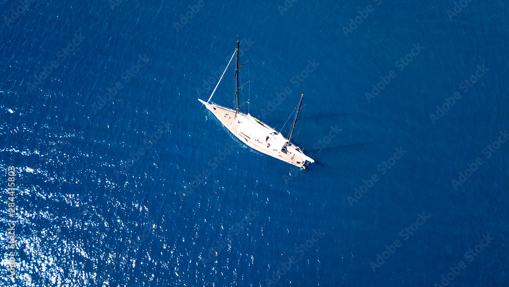Fototapeta premium Aerial drone bird's eye view photo of iconic port of Nidry or Nydri a safe harbor for sail boats and famous for trips to Meganisi, Skorpios and other Ionian islands, Leflkada island, Ionian, Greece