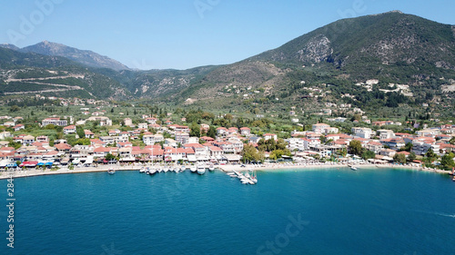 Aerial drone bird's eye view photo of iconic port of Nidry or Nydri a safe harbor for sail boats and famous for trips to Meganisi, Skorpios and other Ionian islands, Leflkada island, Ionian, Greece © aerial-drone