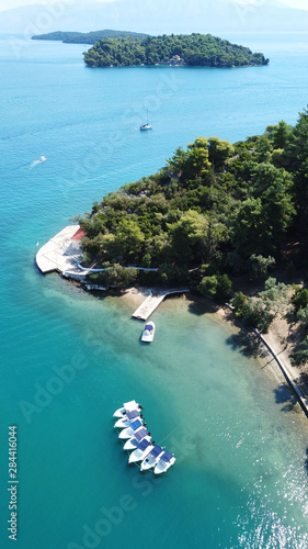 Aerial drone bird's eye view photo of iconic port of Nidry or Nydri a safe harbor for sail boats and famous for trips to Meganisi, Skorpios and other Ionian islands, Leflkada island, Ionian, Greece photo