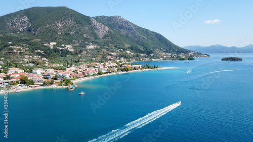 Aerial drone bird s eye view photo of iconic port of Nidry or Nydri a safe harbor for sail boats and famous for trips to Meganisi  Skorpios and other Ionian islands  Leflkada island  Ionian  Greece